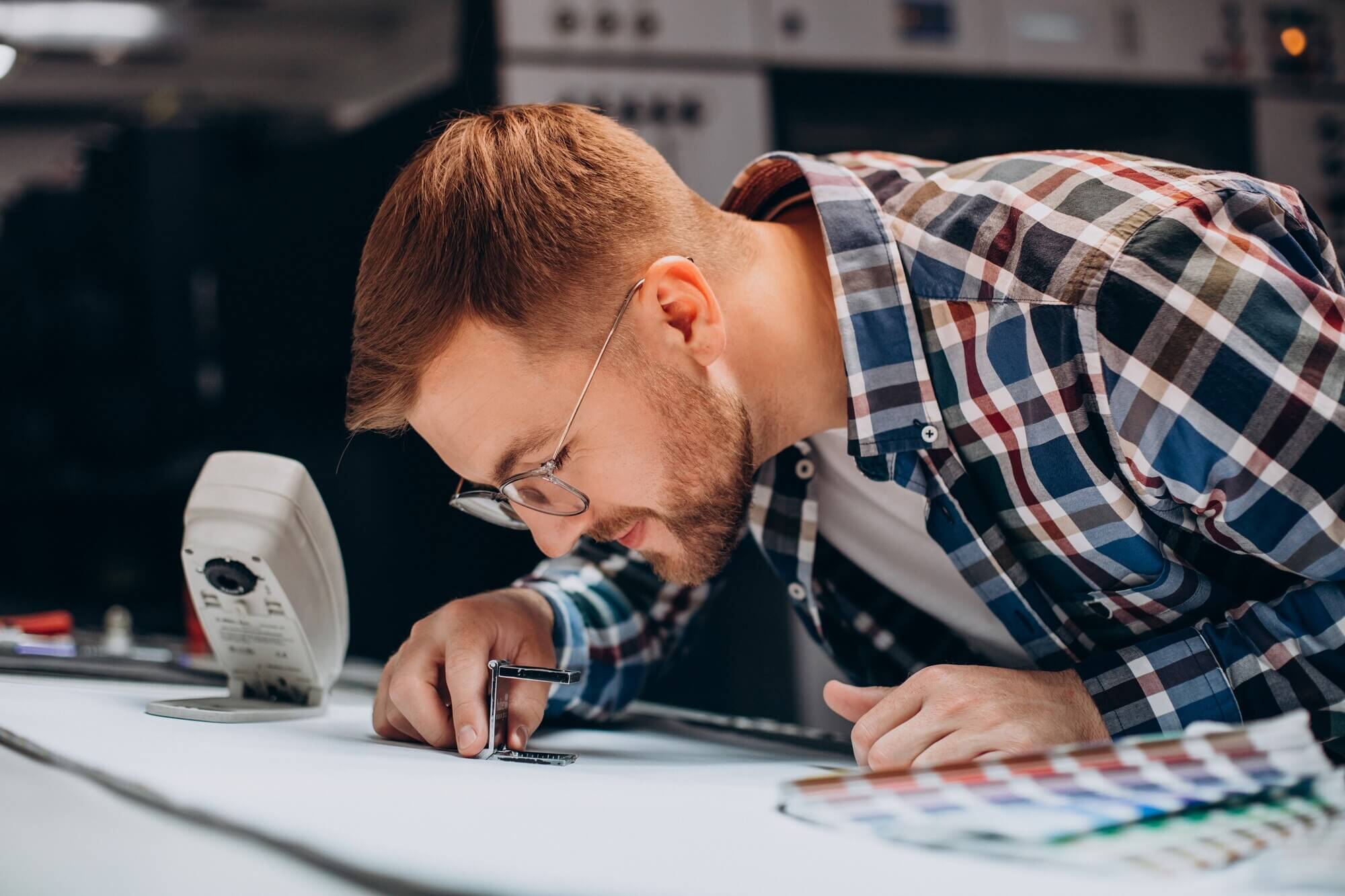 man-working-printing-house-with-paper-paints